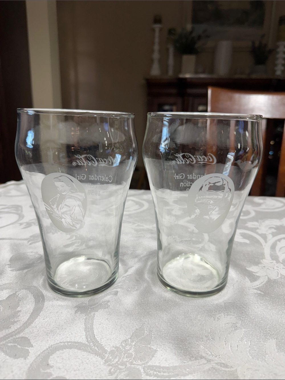(2) Vtg. Coca Cola “Calendar Girl” glasses. Size  32oz